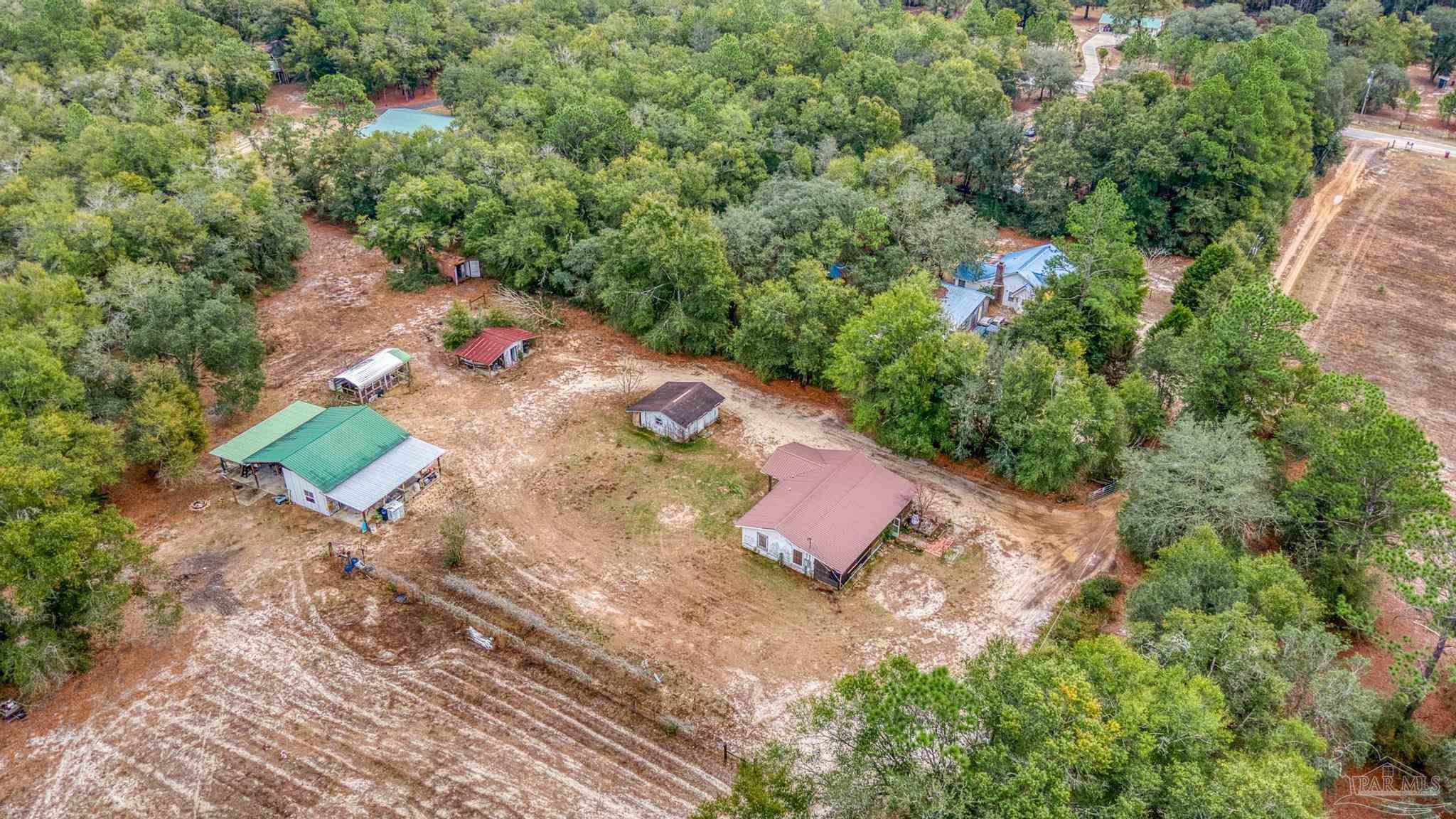10246 Nichols Lake Road Milton, FL 32583 - Photo 14 of 43 an aerial view of a house with a yard