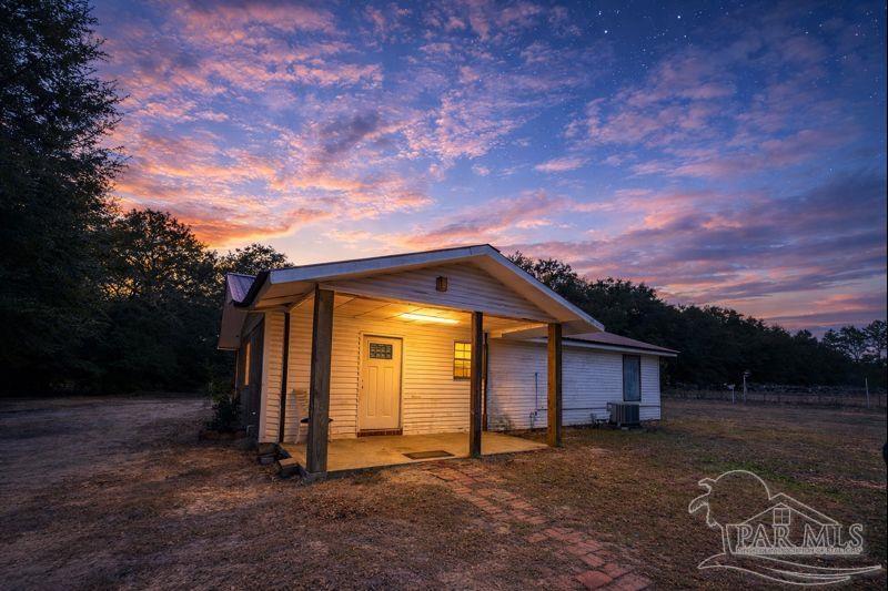 10246 Nichols Lake Road Milton, FL 32583 - Photo 15 of 43 a view of a house with a yard