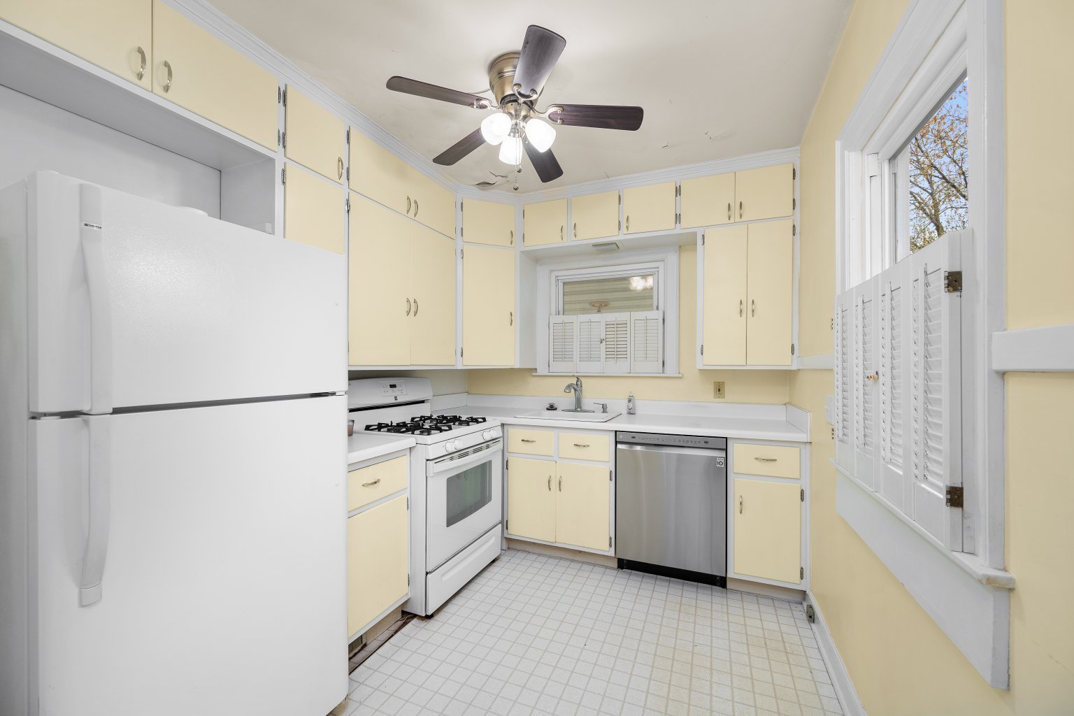 925 24th Street Moline, IL 61265 - Photo 11 of 37 a kitchen with cabinets stainless steel appliances and a chandelier