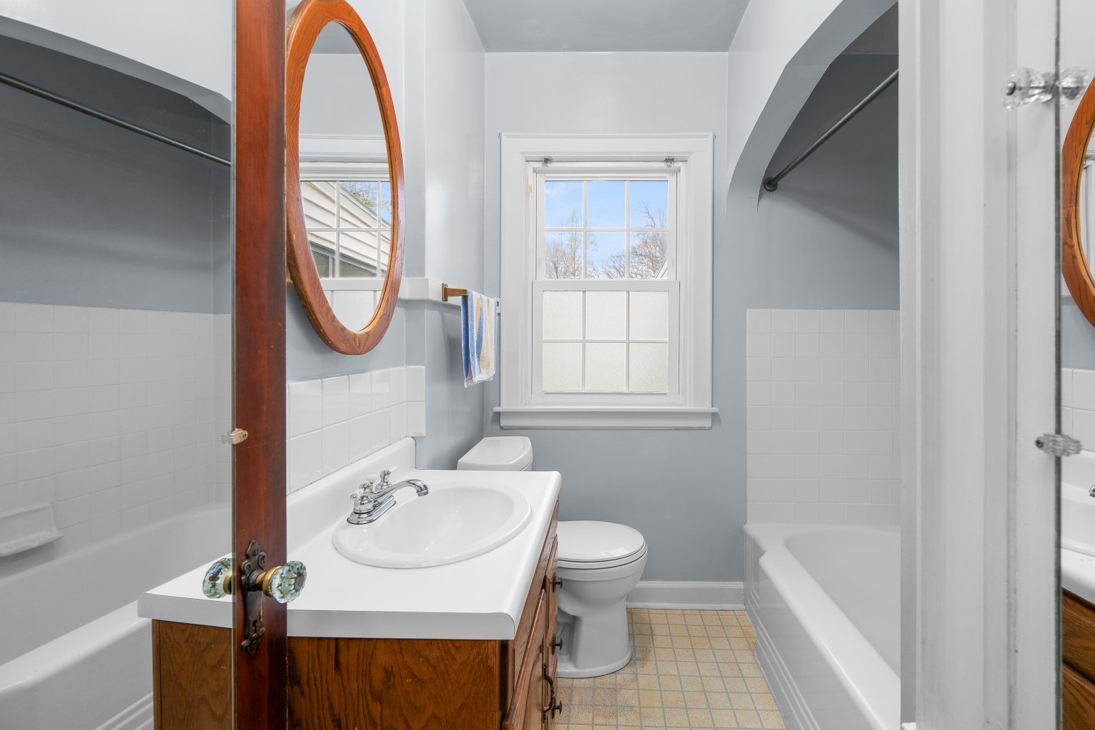 925 24th Street Moline, IL 61265 - Photo 18 of 37 a bathroom with a sink a toilet and a mirror