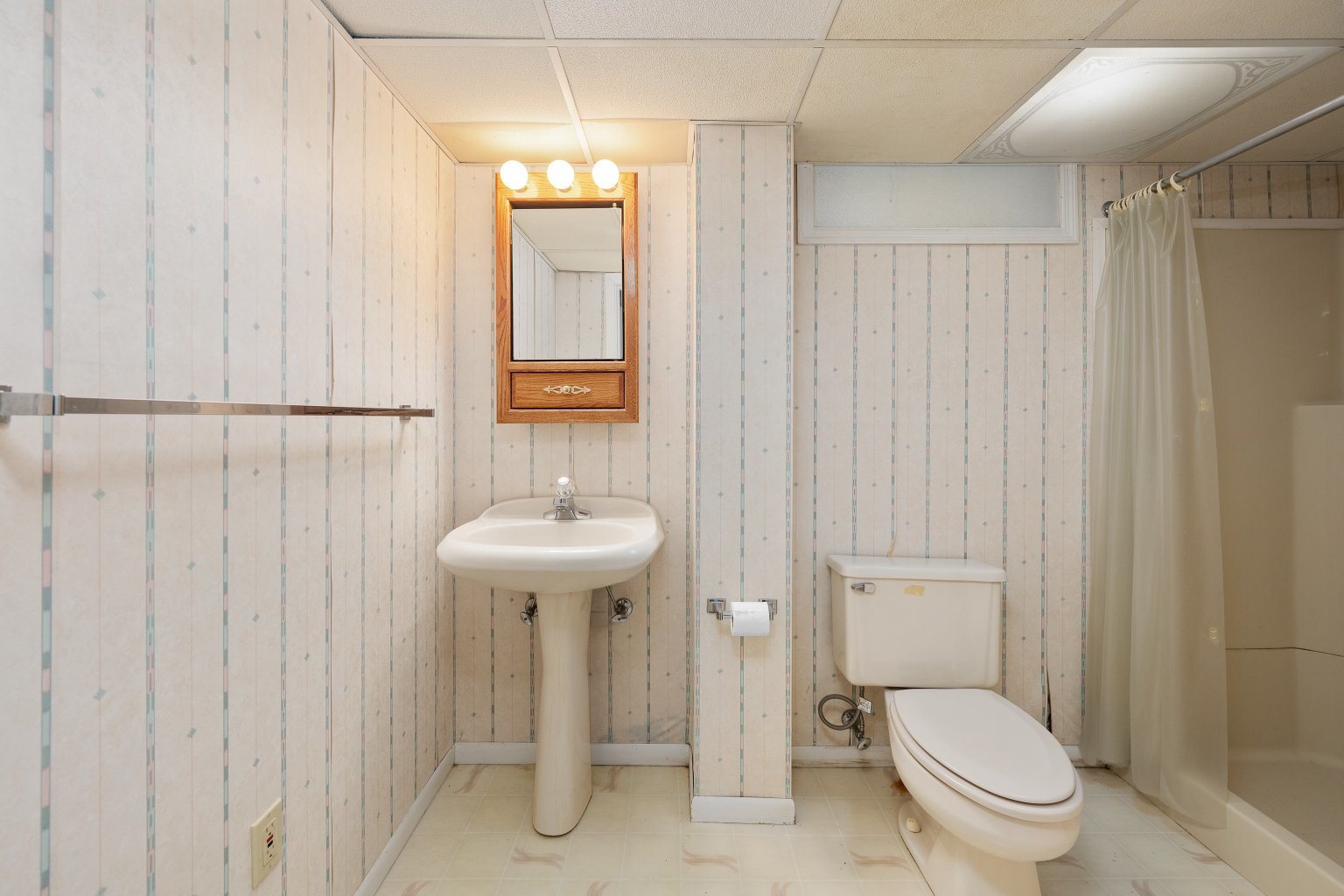 925 24th Street Moline, IL 61265 - Photo 30 of 37 a bathroom with a toilet a sink and a shower