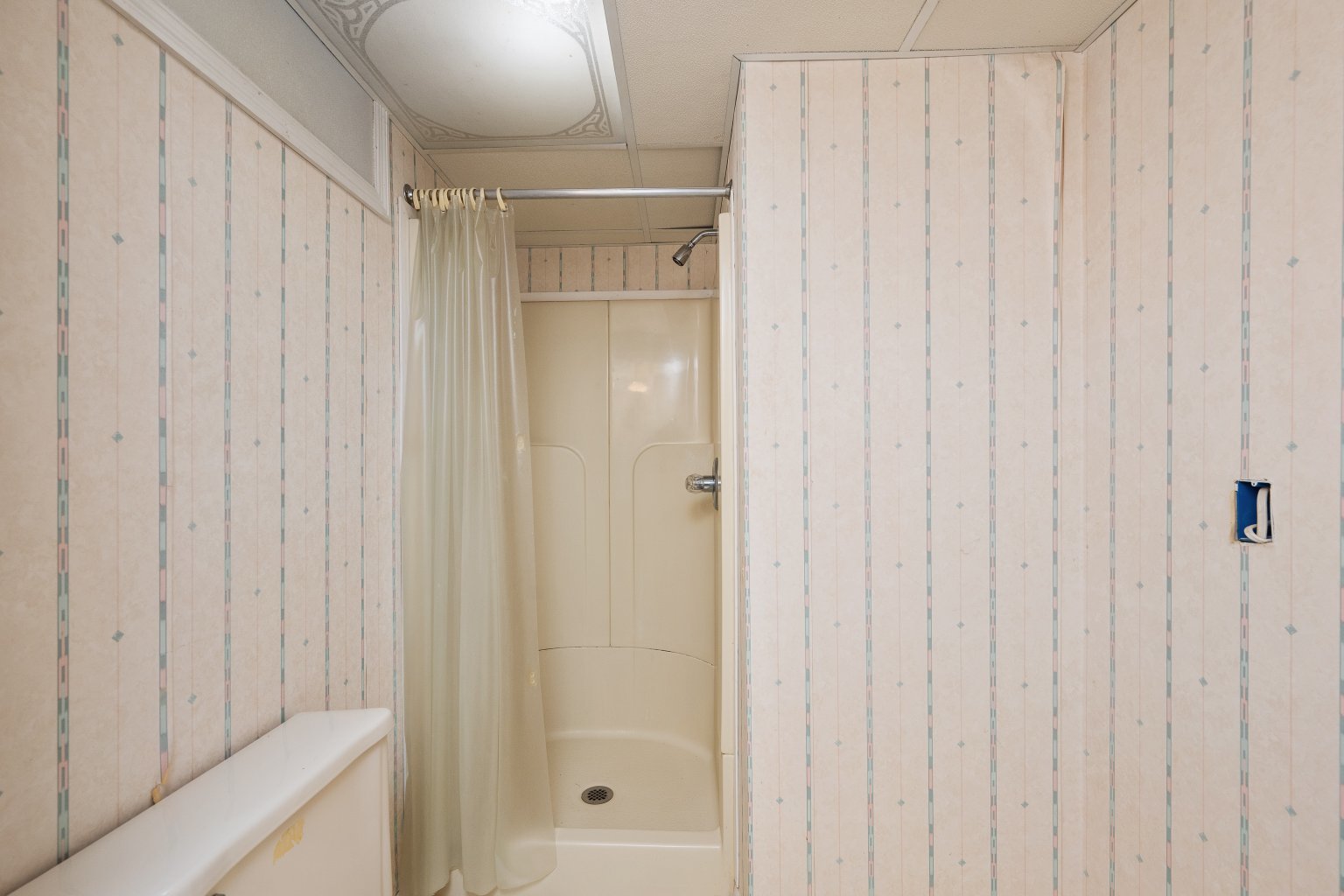 925 24th Street Moline, IL 61265 - Photo 31 of 37 a bathroom with a shower and a glass door