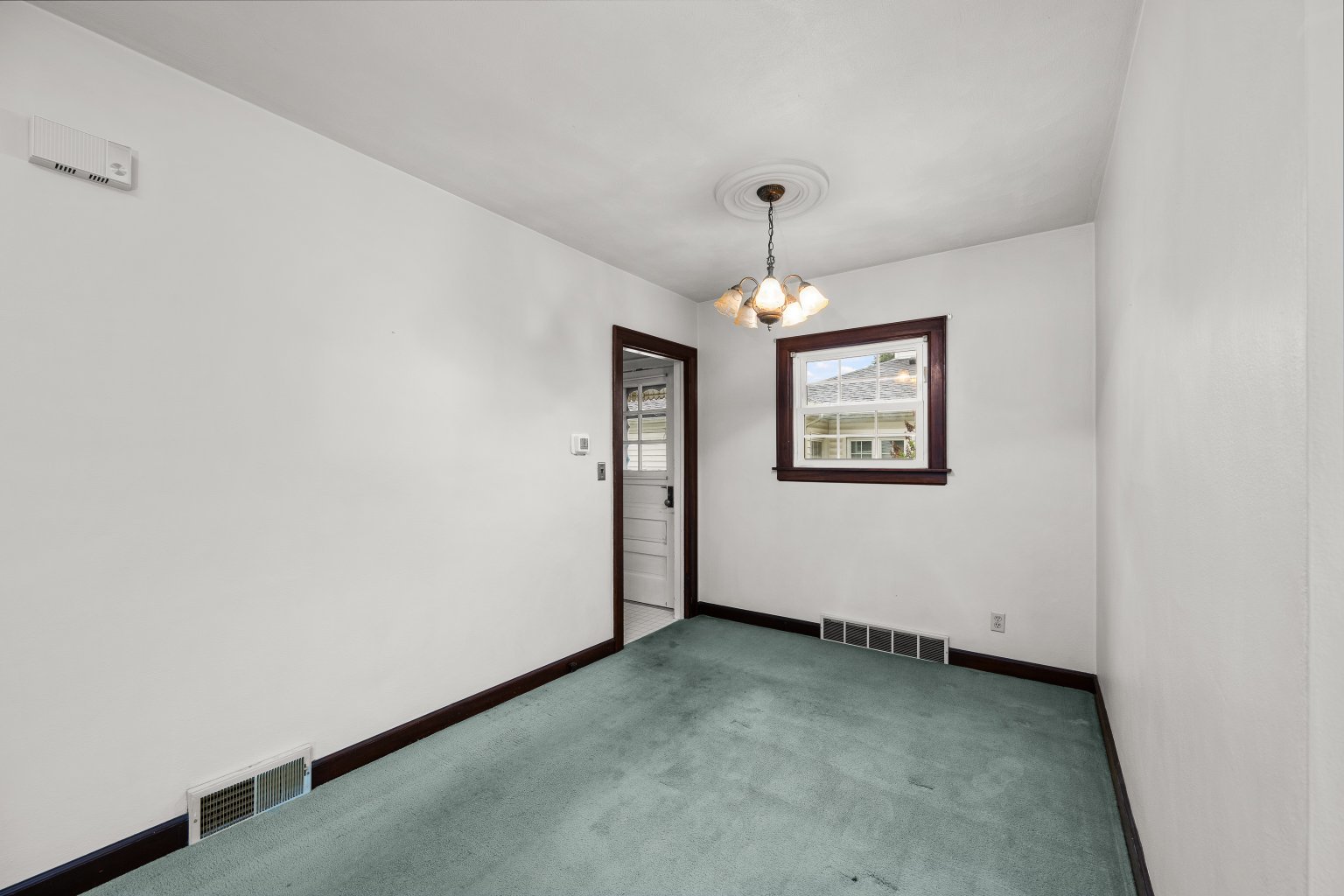 925 24th Street Moline, IL 61265 - Photo 9 of 37 an empty room with chandelier fan