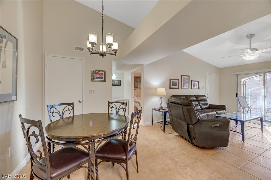 7885 West Flamingo Road, Unit 1071 Las Vegas, NV 89147 - Photo 9 of 28 Naturally illuminated living space features vaulted ceilings and ceramic tile flooring.