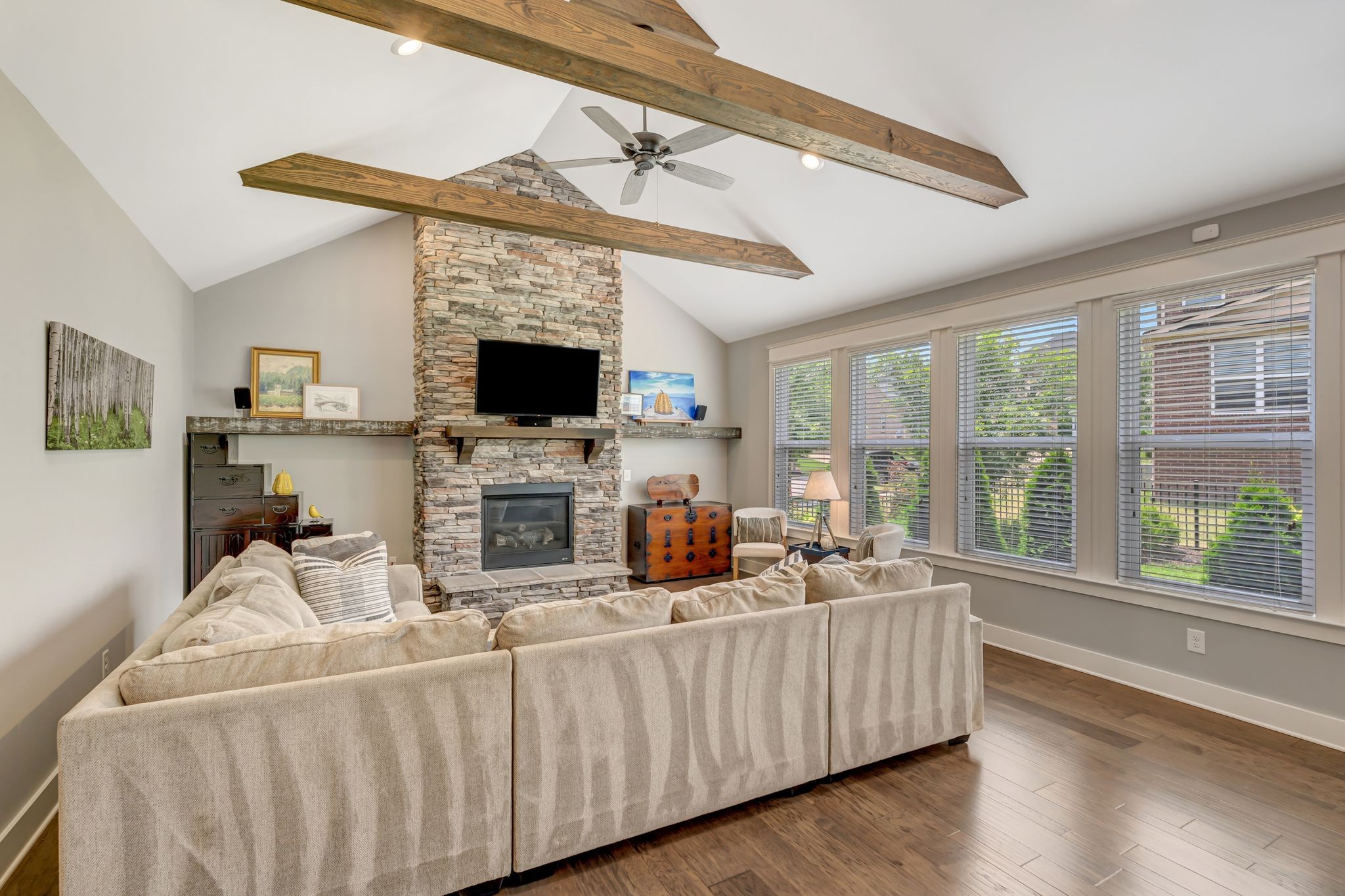 607 Beamon Drive Franklin, TN 37064 - Photo 23 of 45 a living room with furniture a flat screen tv and a floor to ceiling window
