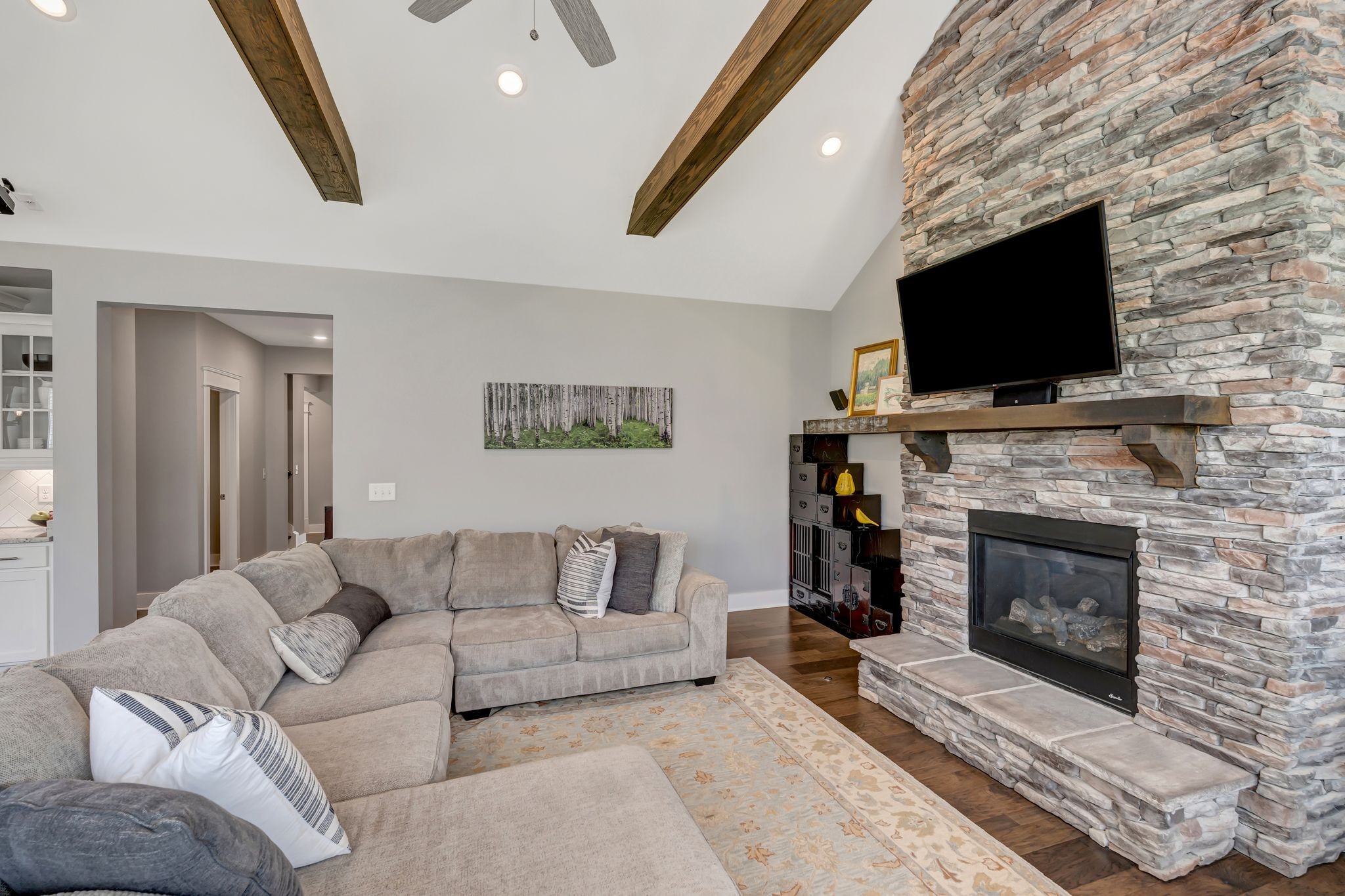 607 Beamon Drive Franklin, TN 37064 - Photo 24 of 45 a living room with furniture a flat screen tv and a fireplace