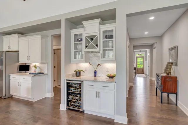 a living room with furniture and a ceiling fan