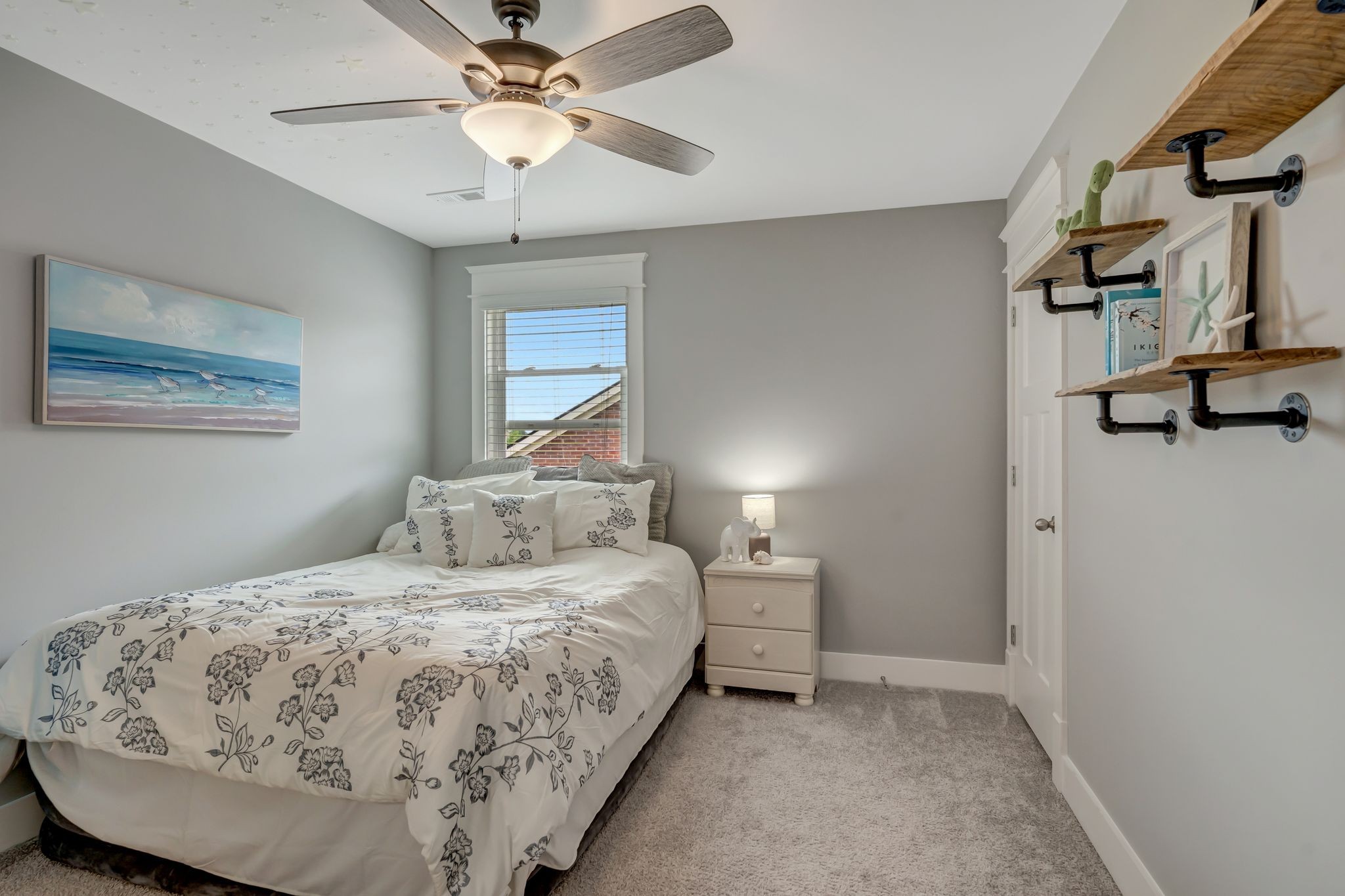 607 Beamon Drive Franklin, TN 37064 - Photo 35 of 45 a bedroom with a bed and a chandelier