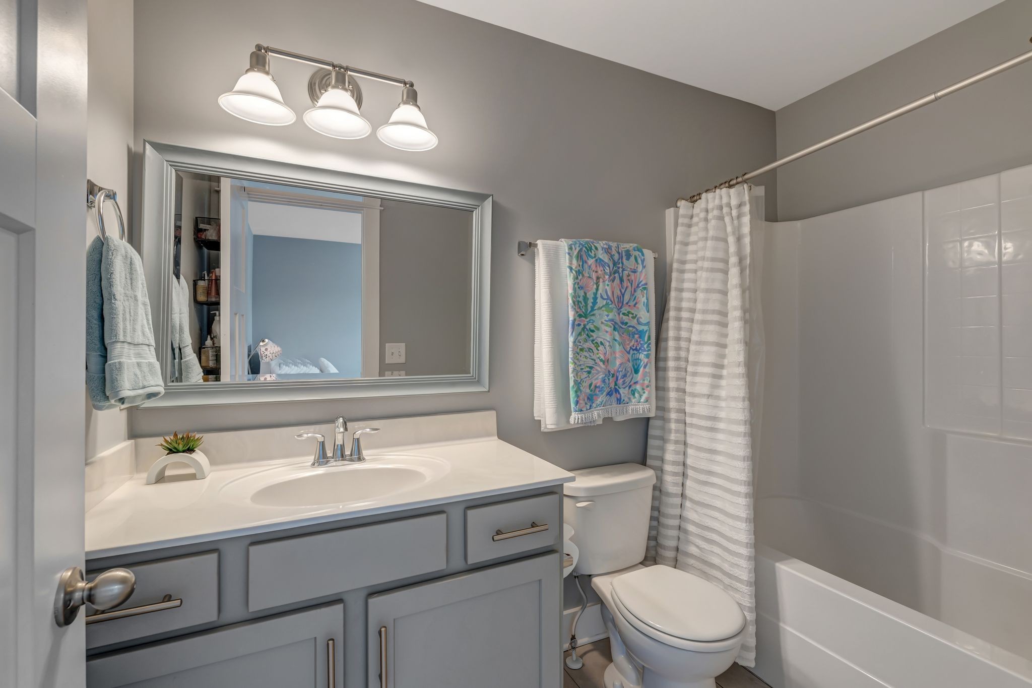 607 Beamon Drive Franklin, TN 37064 - Photo 39 of 45 a bathroom with a toilet sink vanity and mirror