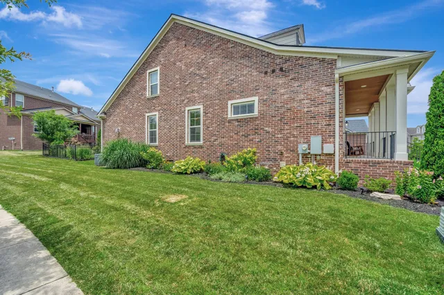 a brick house with a yard