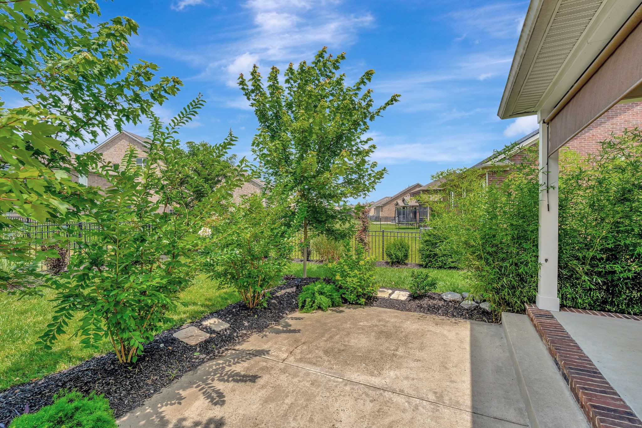 607 Beamon Drive Franklin, TN 37064 - Photo 44 of 45 a view of a garden with plants and a bench