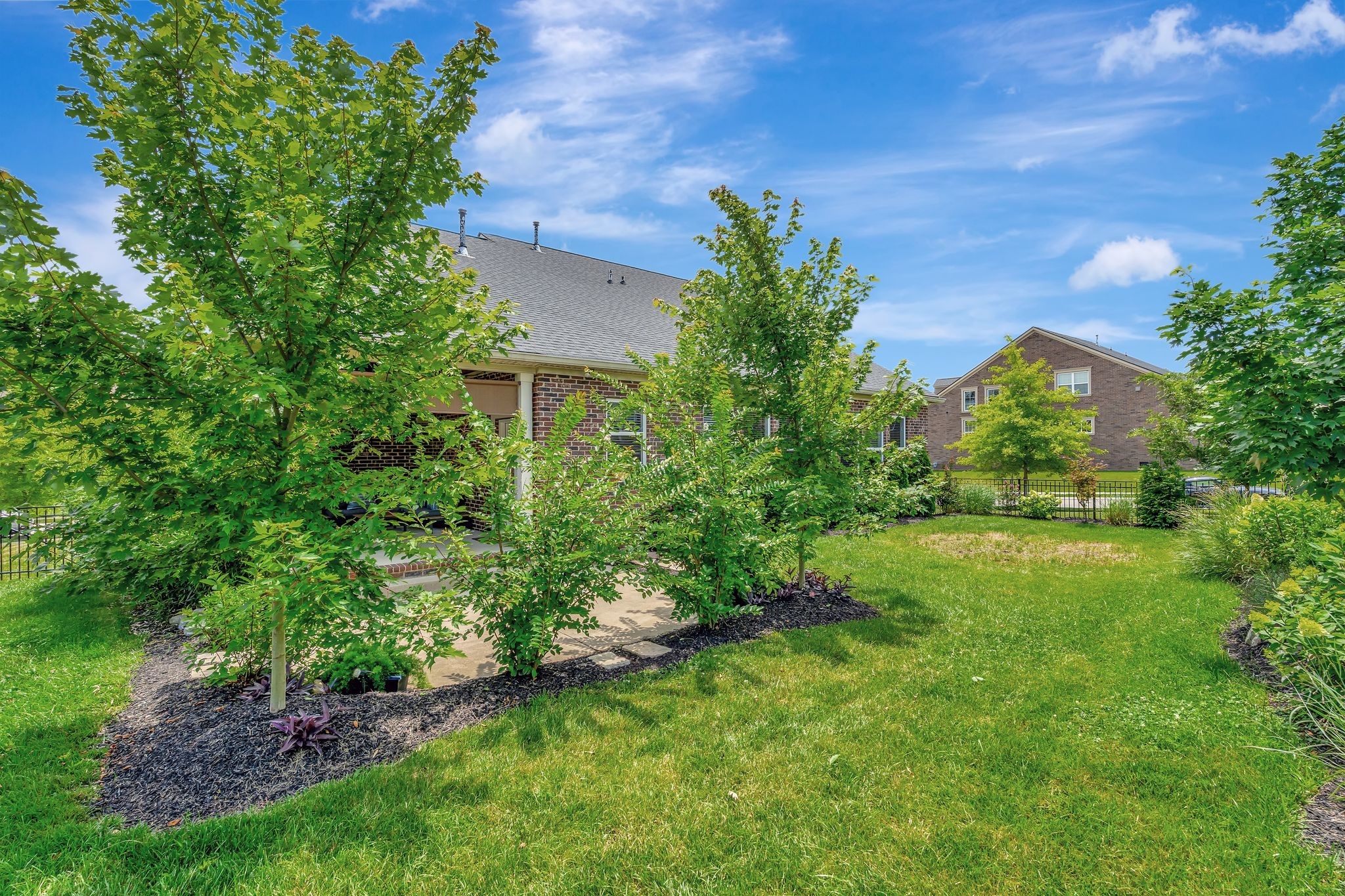 607 Beamon Drive Franklin, TN 37064 - Photo 45 of 45 a view of a garden with a building in the background