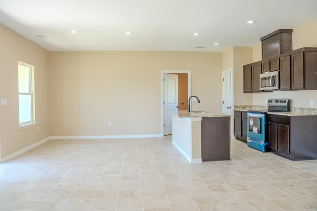 a view of kitchen with furniture and window