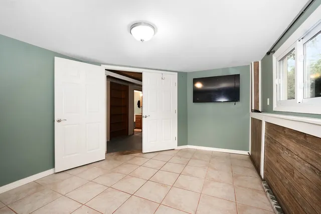 a view of a room with window and wooden floor