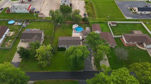 an aerial view of a house with a lake view