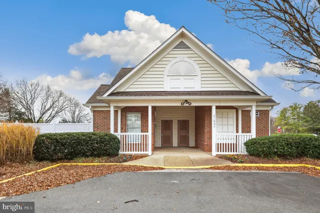 a view of a brick house with a large windows