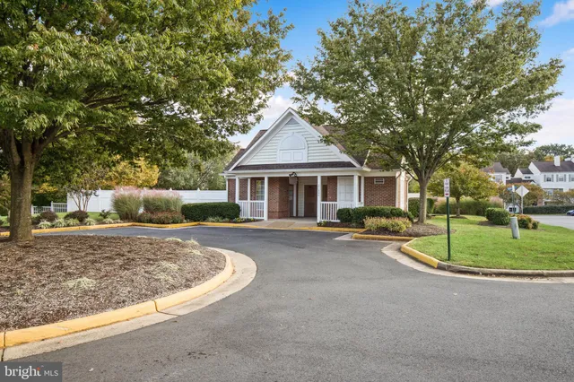 a front view of a house with a garden and porch