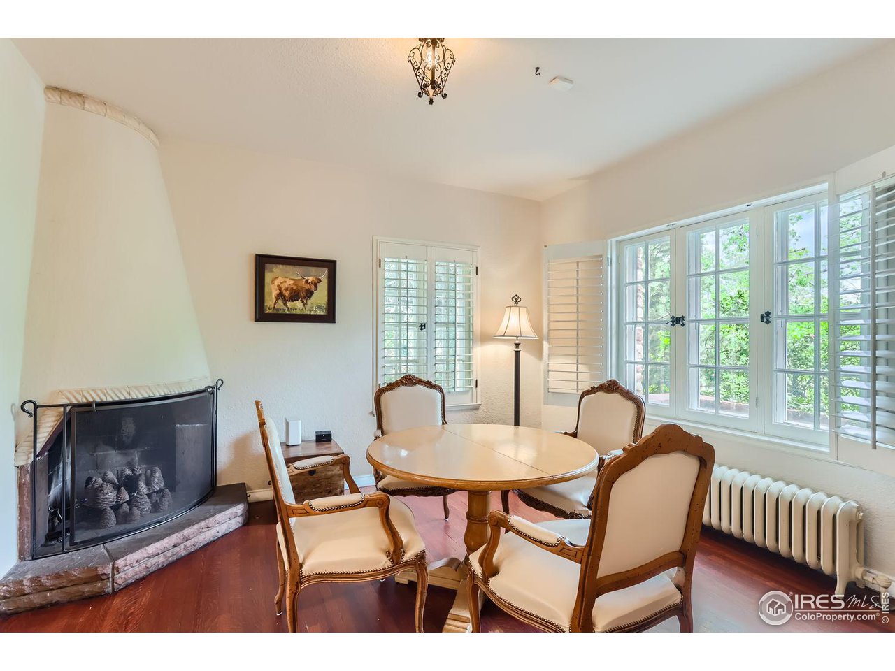 707 14th Street Boulder, CO 80302 - Photo 16 of 40 An extension of the kitchen, reading/tv room/breakfast nook with gas fireplace with pine cone "logs"