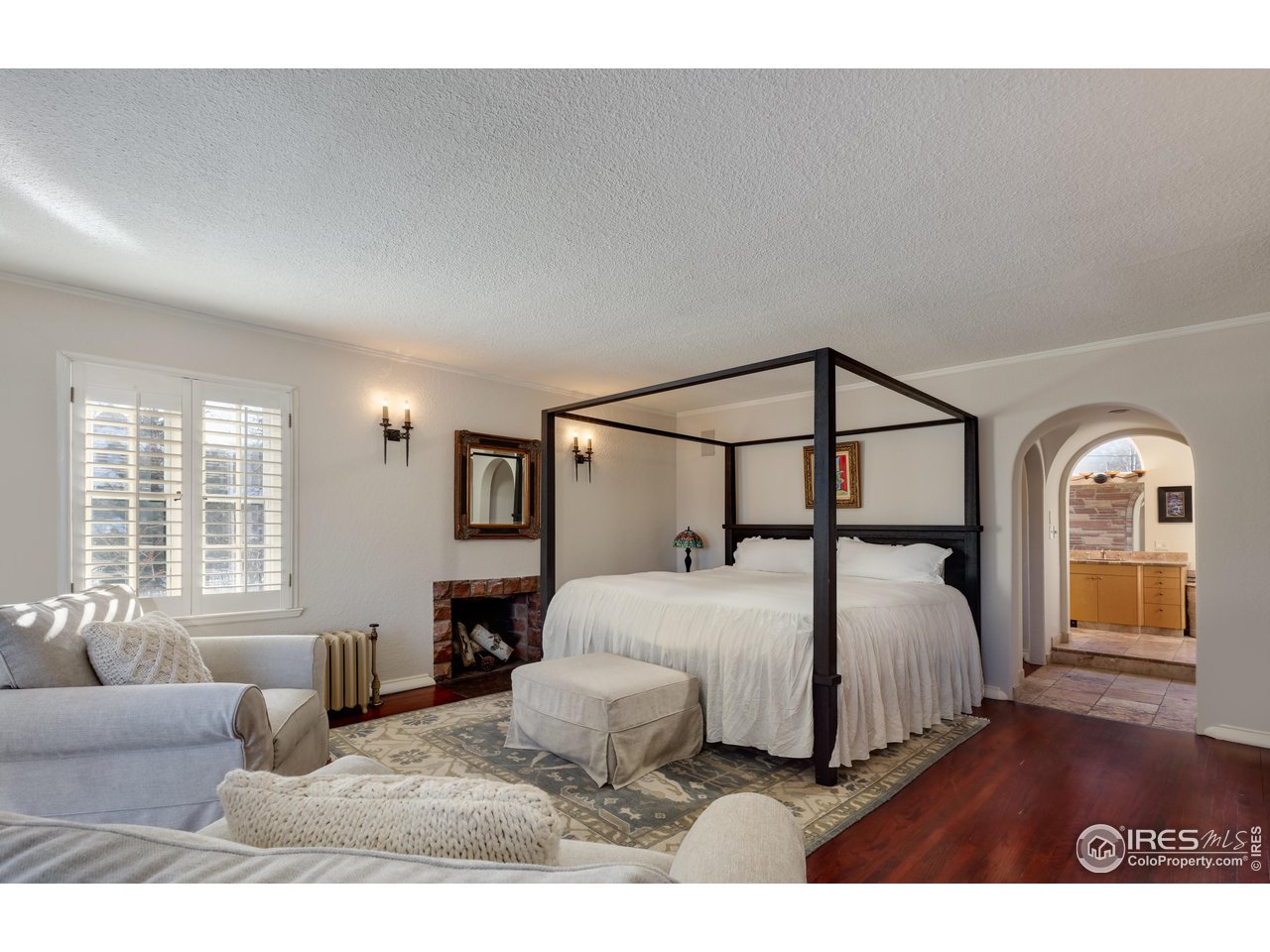 707 14th Street Boulder, CO 80302 - Photo 21 of 40 Spacious, sunny primary suite with cozy wood burning fireplace and Flatirons greetings as you enter the bathroom