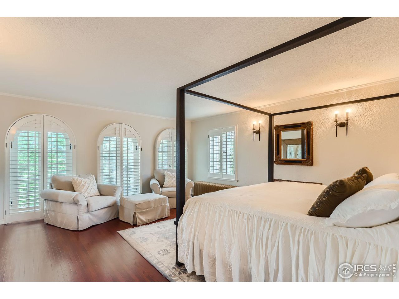 707 14th Street Boulder, CO 80302 - Photo 22 of 40 Primary bedroom with cozy wood burning fireplace