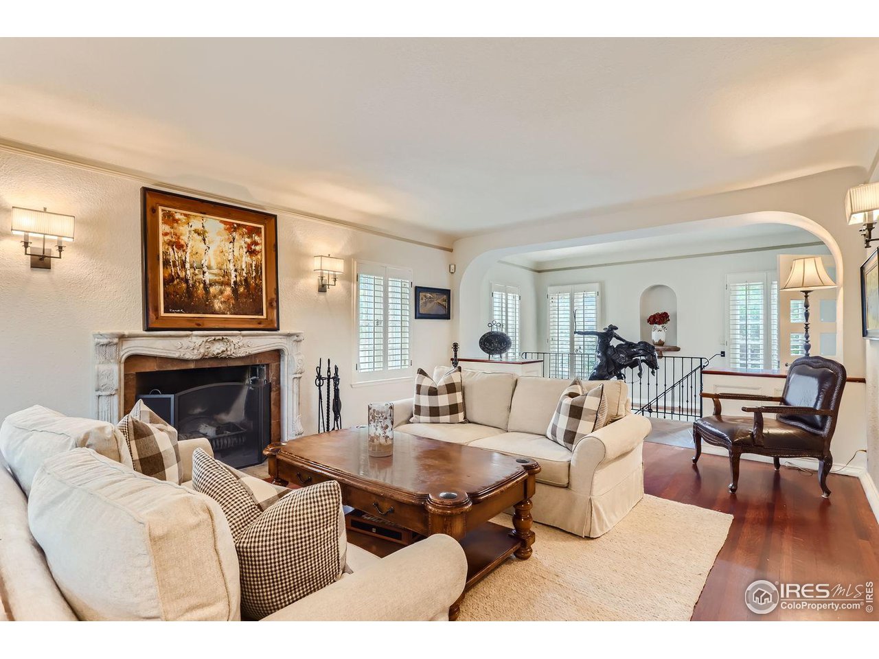 707 14th Street Boulder, CO 80302 - Photo 7 of 40 Wood burning fireplace and sunny windows for a most welcoming living room.