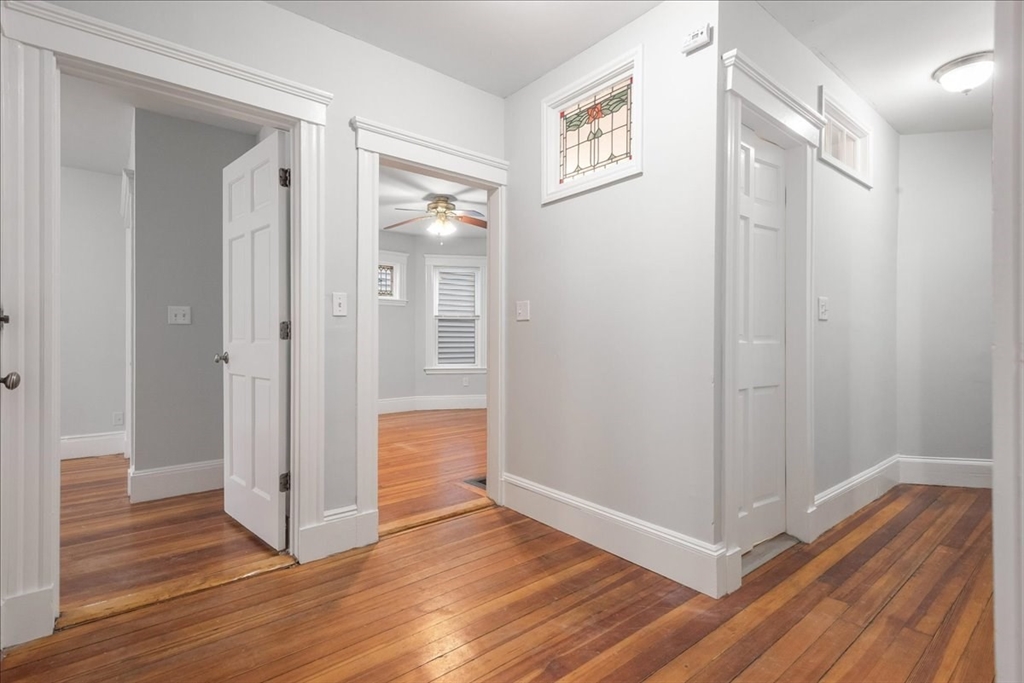 4 Bailey Street, Unit 1 Boston, MA 02124 - Photo 2 of 11 a view of a hallway with wooden floor