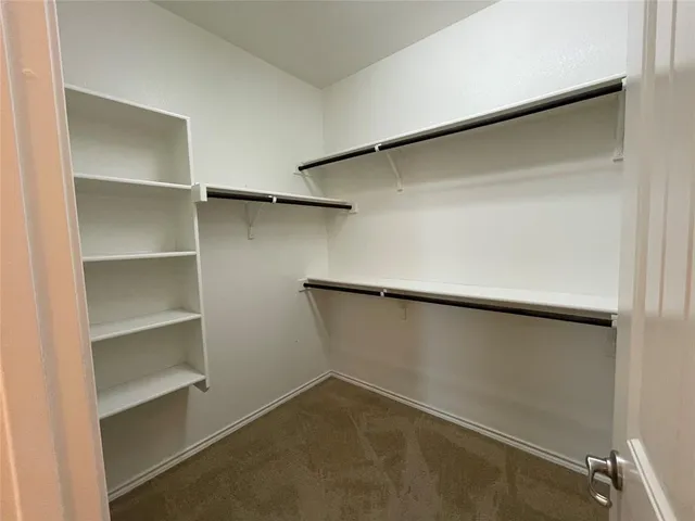 a view of an empty walk in closet