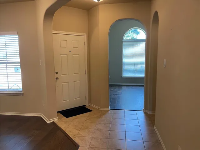 a view of entryway with wooden floor
