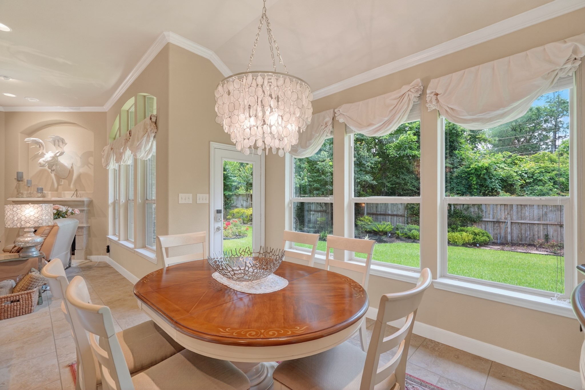 55 South Victoriana Circle Spring, TX 77389 - Photo 22 of 40 a view of a dining room with furniture a chandelier and wooden floor