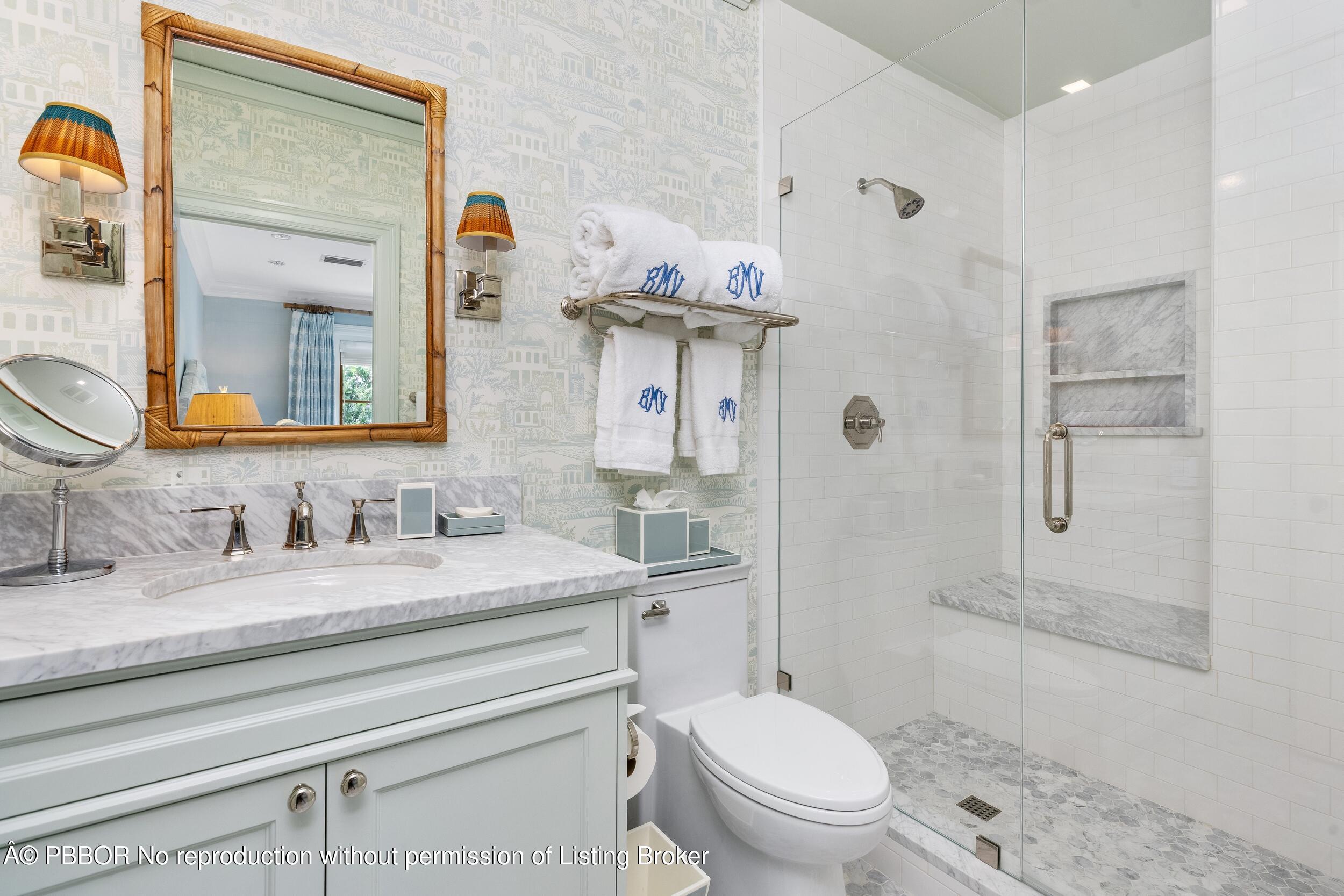 258 List Road Palm Beach, FL 33480 - Photo 31 of 45 a bathroom with a granite countertop sink mirror vanity and toilet