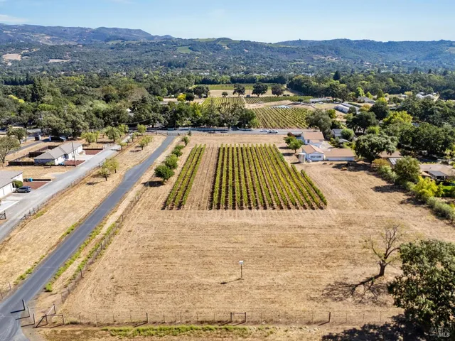 a view of a swimming pool with mountains in the background