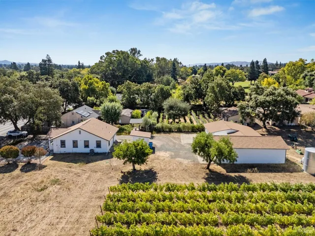 an aerial view of a house with a garden