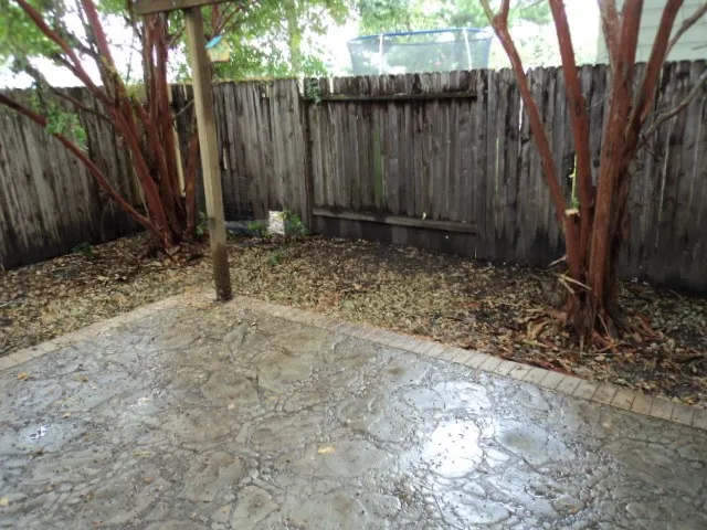 a backyard of a house with lots of green space