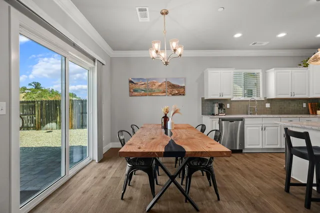a view of kitchen with cabinets and wooden floor