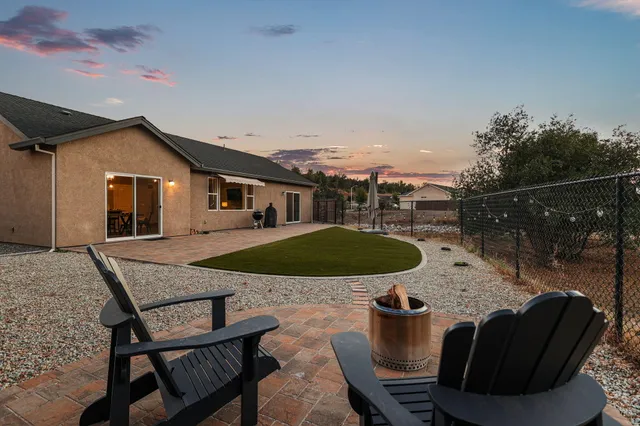 a view of a swimming pool with a patio
