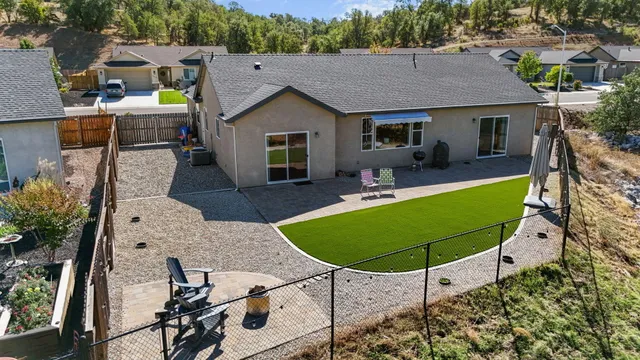an outdoor space with furniture and garden