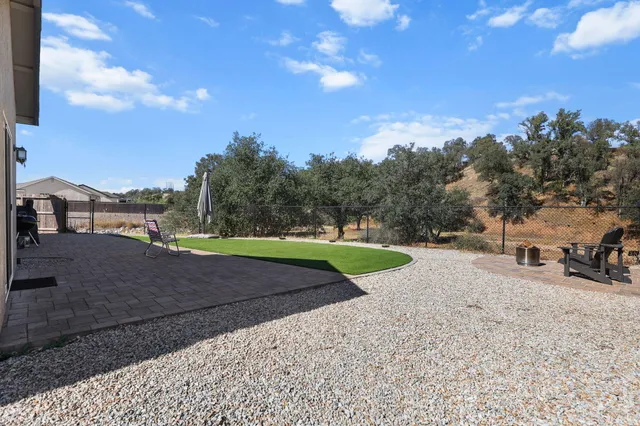 an aerial view of a house with outdoor space