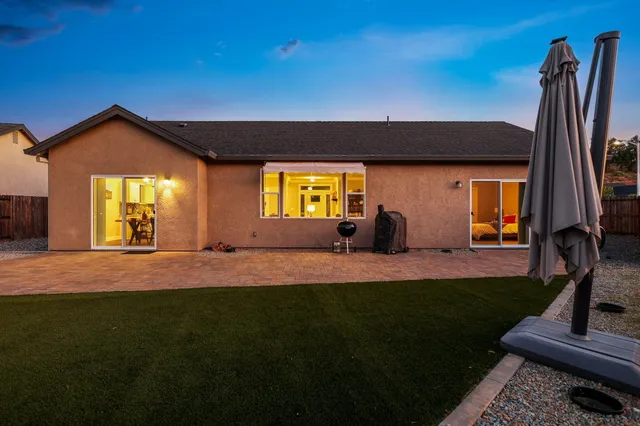 an aerial view of residential houses with outdoor space and street view