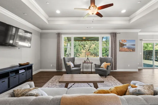 a living room with furniture and a flat screen tv