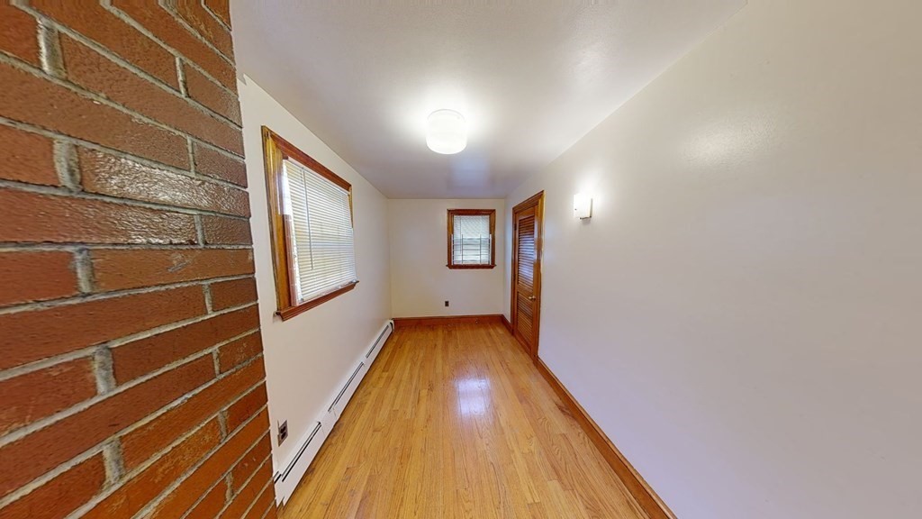 1 Normandy Street, Unit 3 Boston, MA 02121 - Photo 11 of 33 a view of bathroom with wooden floor and window