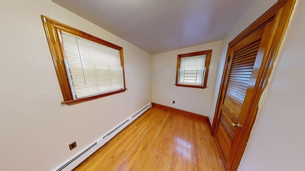 1 Normandy Street, Unit 3 Boston, MA 02121 - Photo 13 of 33 a view of a room with wooden floor and windows