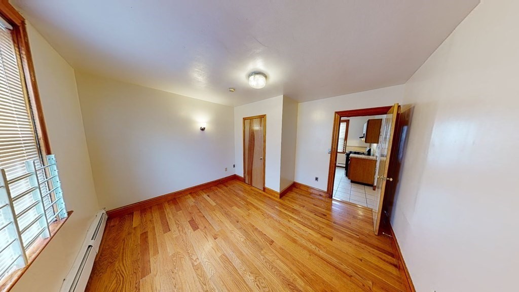1 Normandy Street, Unit 3 Boston, MA 02121 - Photo 18 of 33 a view of a room with wooden floor and stairs