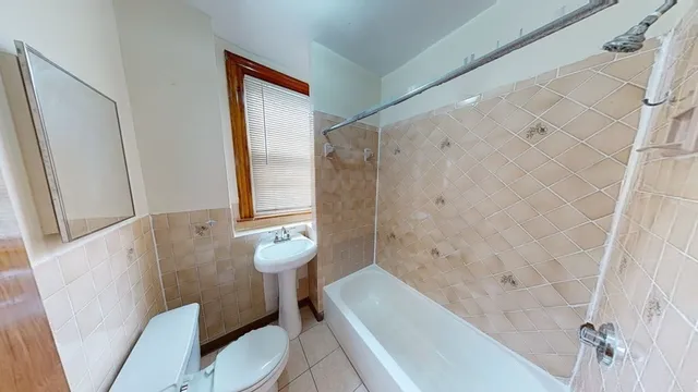 a bathroom with a toilet and a bathtub
