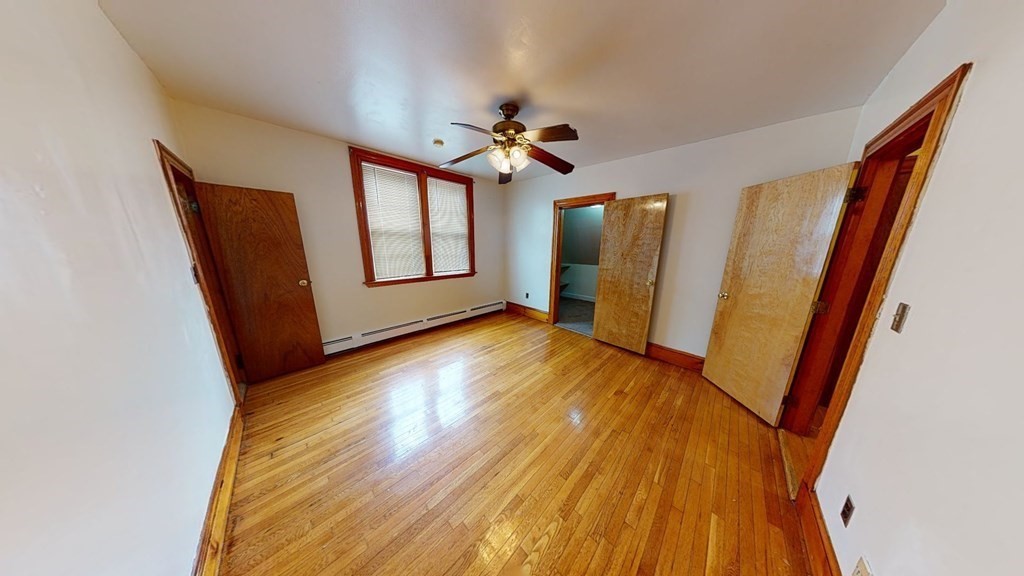 1 Normandy Street, Unit 3 Boston, MA 02121 - Photo 30 of 33 a view of an empty room with window and wooden floor