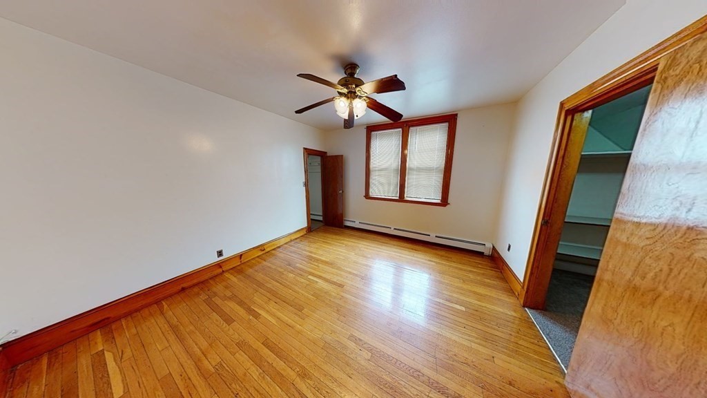 1 Normandy Street, Unit 3 Boston, MA 02121 - Photo 31 of 33 a view of empty room with wooden floor and fan