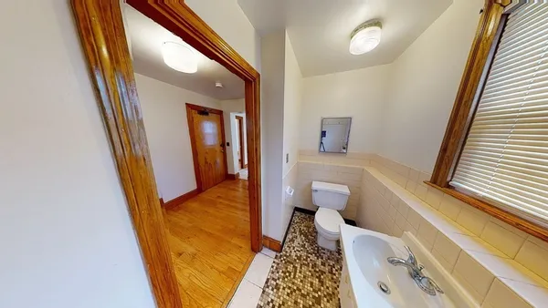 a bathroom with a sink and toilet