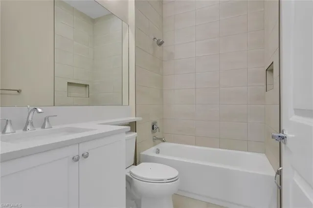 a bathroom with a sink a toilet and a bathtub