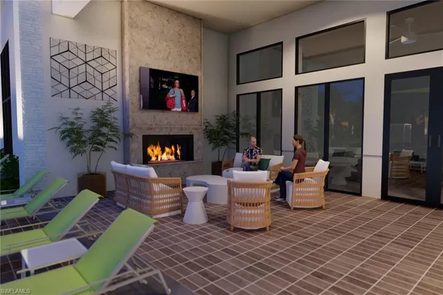 a living room with fireplace furniture and a fireplace