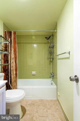 a bathroom with a toilet and shower