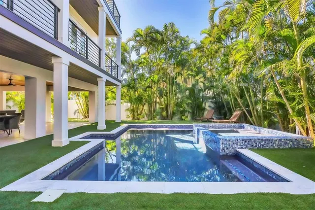 a view of a swimming pool with a patio